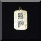 J21. Gold and diamond SP pendant. 